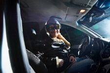 Free Funny Male Driver In A Leather Jacket In The Car In The Dark. Night Photo Shoot Royalty Free Stock Photo - 145630995