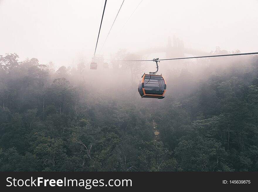 DANANG, VIETNAM. Cable cabs are running on high wire at Bana Hills in Danang, Vietnam. Bana Hills is interesting tourist new places to visit