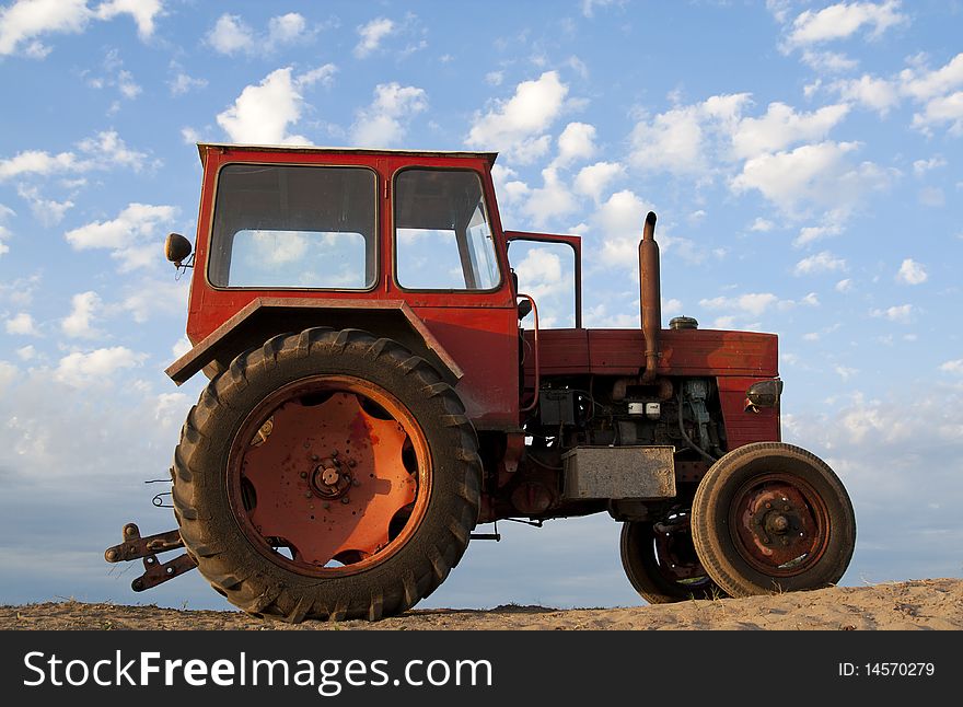 Very old tractor in action, commercial agriculture