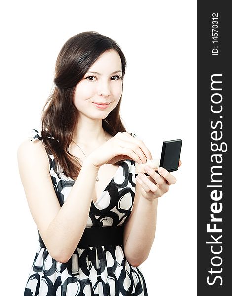 Girl with compact powder and brush isolated on white