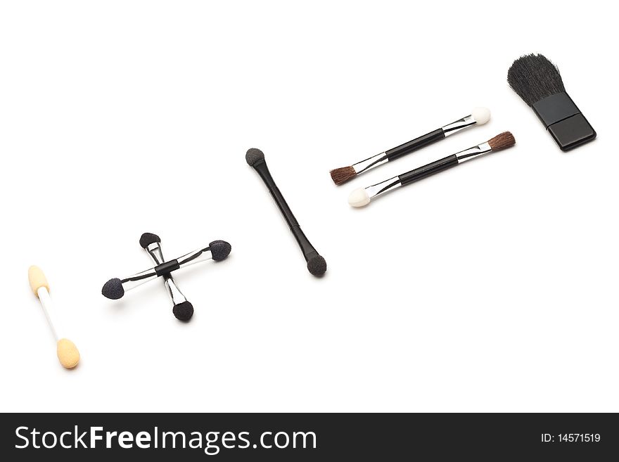 Professional cosmetic accessories on a white background