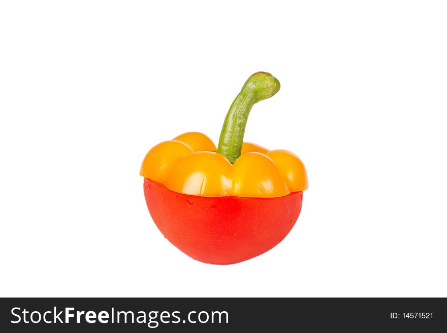 Top of yellow pepper on red tomato. Top of yellow pepper on red tomato