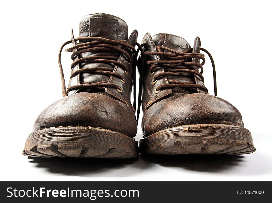 Pair of old brown shoes on white background. Pair of old brown shoes on white background