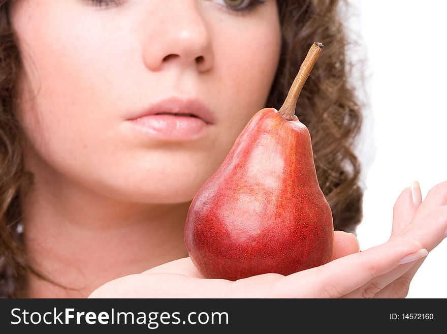 Beauty brunet woman`s fase and pear in hand. Beauty brunet woman`s fase and pear in hand.