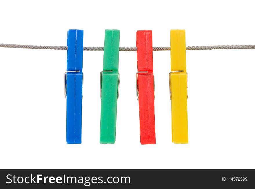 Clothespins hang on a cord isolated over white