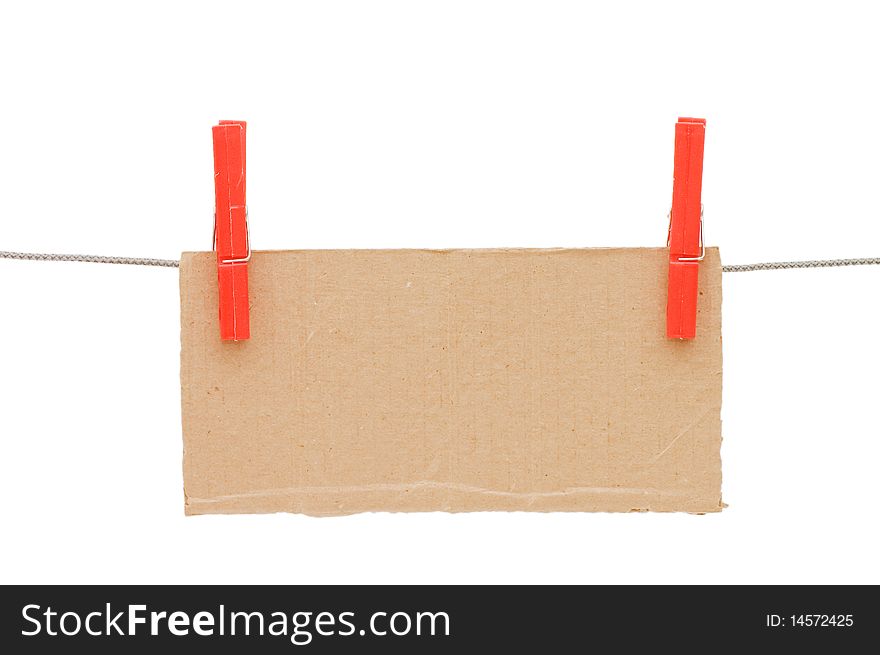 The cardboard tablet hangs on a cord isolated over white