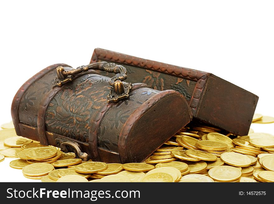 Wooden casket full of coins isolated on white