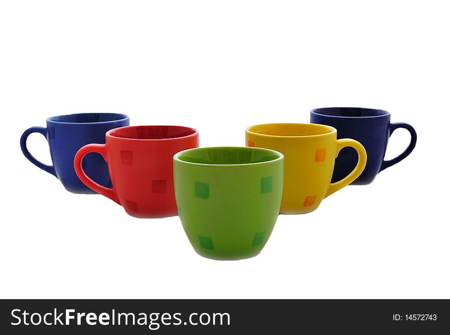 Isolated bright tea cups arranged as a wedge. Isolated bright tea cups arranged as a wedge