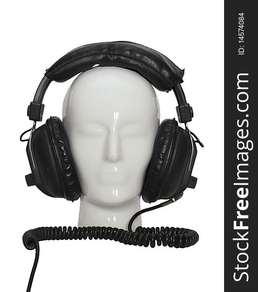 Porcelin head with retro headphones isolated on white. Porcelin head with retro headphones isolated on white