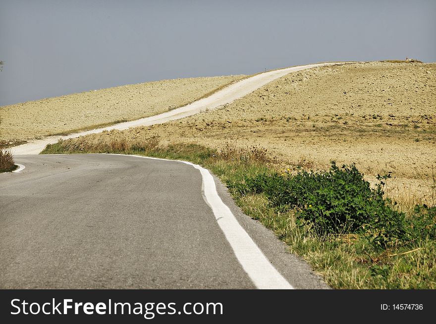 Desert road on th hills of central italy