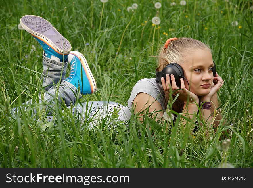 Girl listen music. outdoor shot