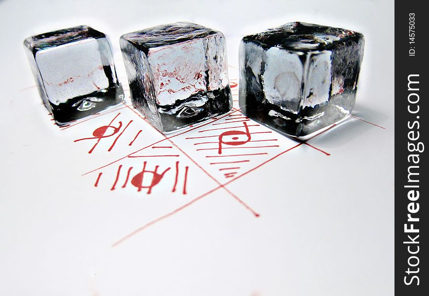 Three crystal cubes on a red drawing. Three crystal cubes on a red drawing