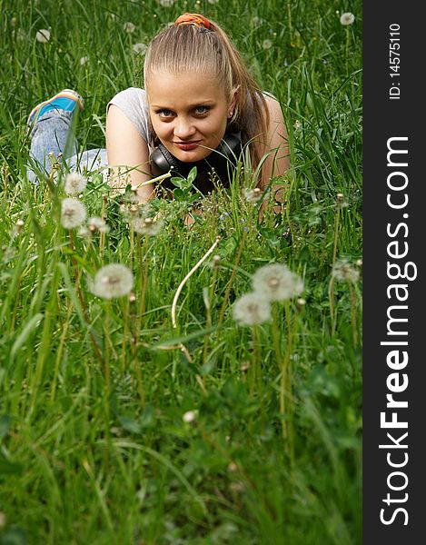 Girl on meadow with dandelion