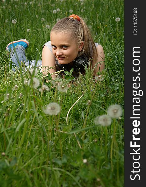 Girl on meadow in summer day