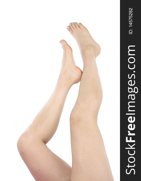 Woman legs and feet isolated over white background