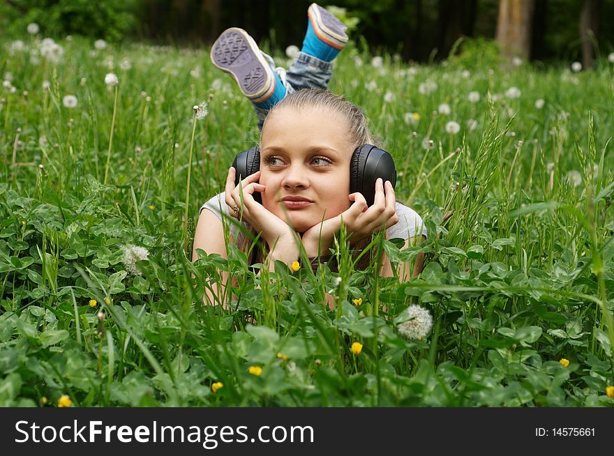 Girl on meadow in summer day