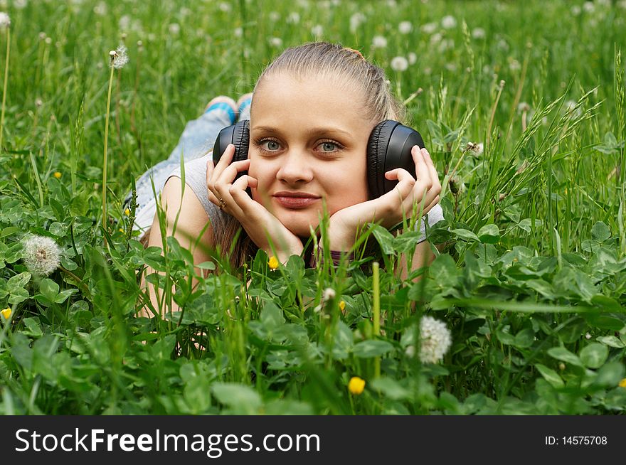 Happy young girl on meadow