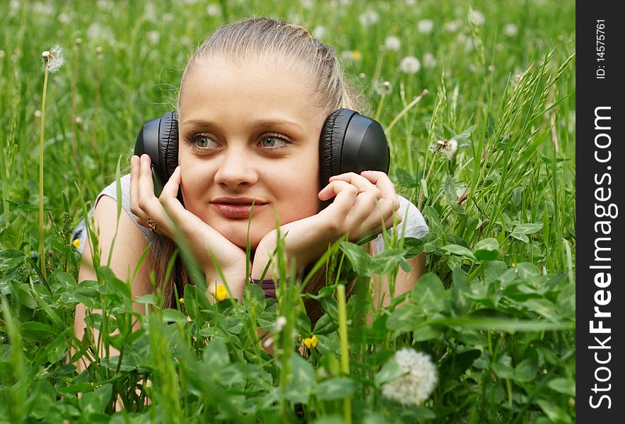 Girl on meadow with dandelion