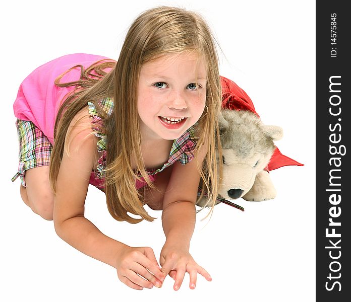 Happy five year old girl pretending to be a dog with her stuffed wonder dog. Happy five year old girl pretending to be a dog with her stuffed wonder dog.