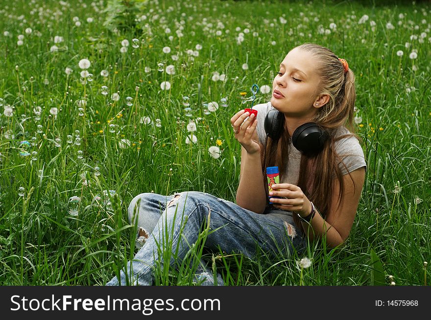 Girl on meadow with dandelion