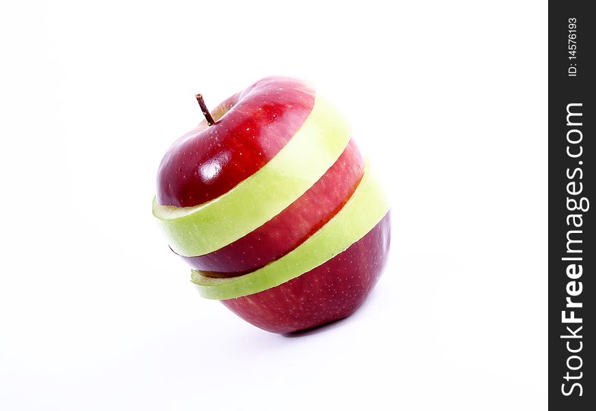Green and red apple slices on white background. Concepts: Fruit, Food, Nutrition and Welfare