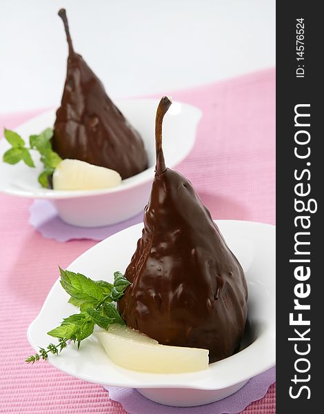 Still image of two chocolate pears