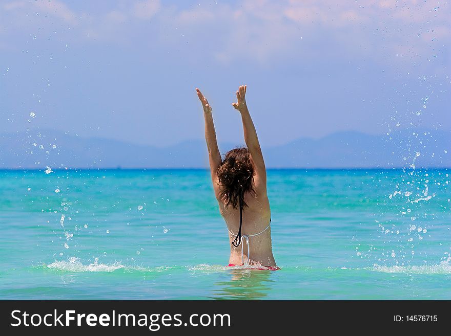 Girl with long hair playing in the sea. Girl with long hair playing in the sea