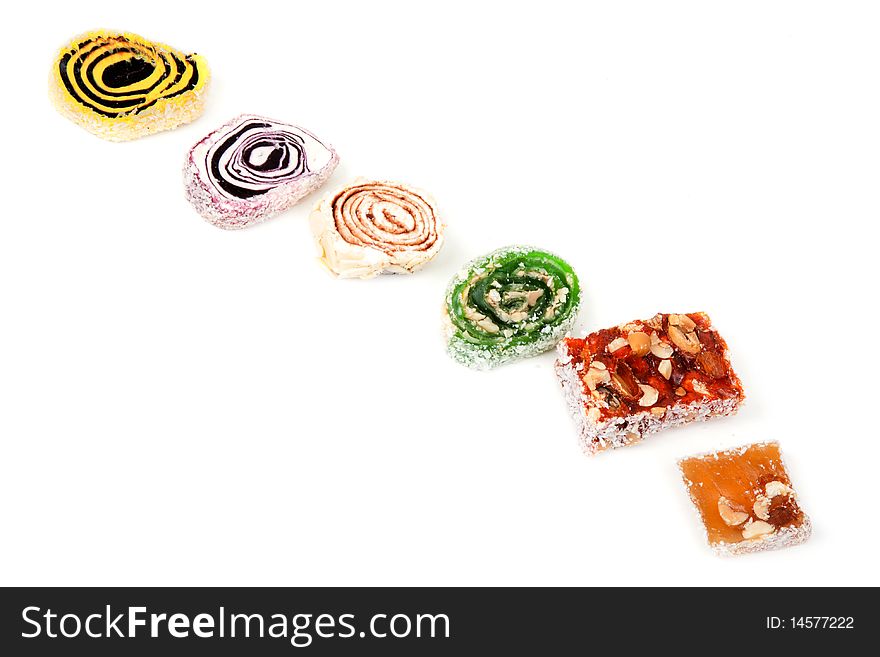 East sweetnesses, sweetmeats put on white background inline