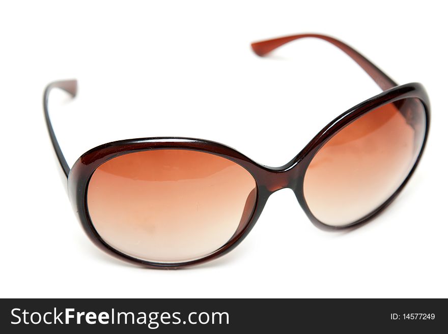 Brown sunglasses with translucent lens on white background