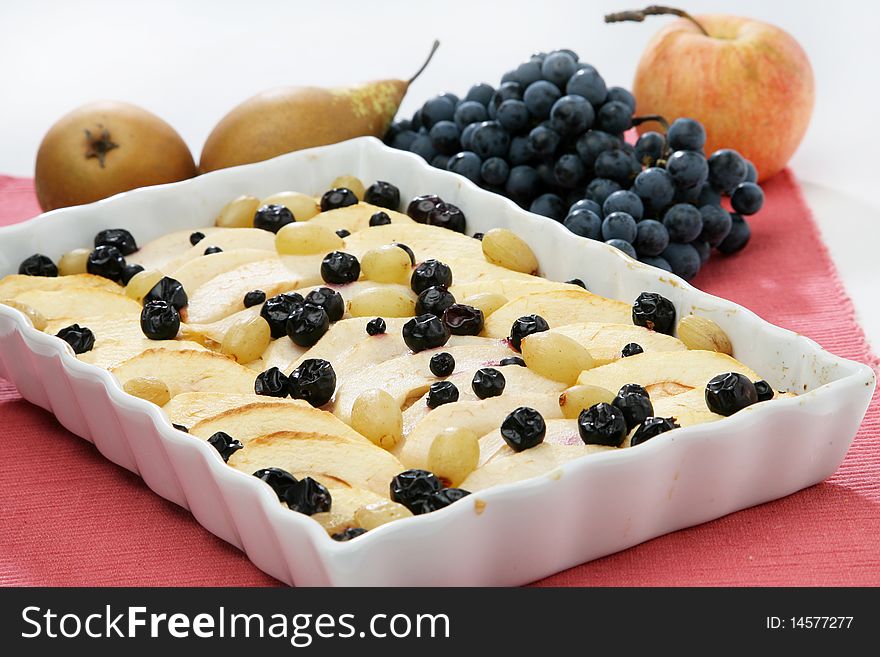 Fruit pie cake with pear apple and grapes