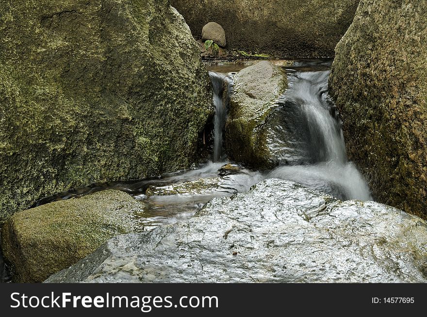 Waterfalls in the Japanese garden.  Early summer cloudy day