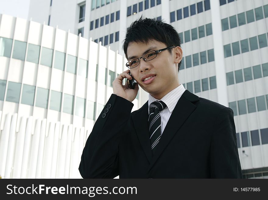 Asian businessman talking on the phone