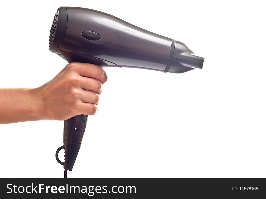Hair dryer in woman's hand. Isolated on white background
