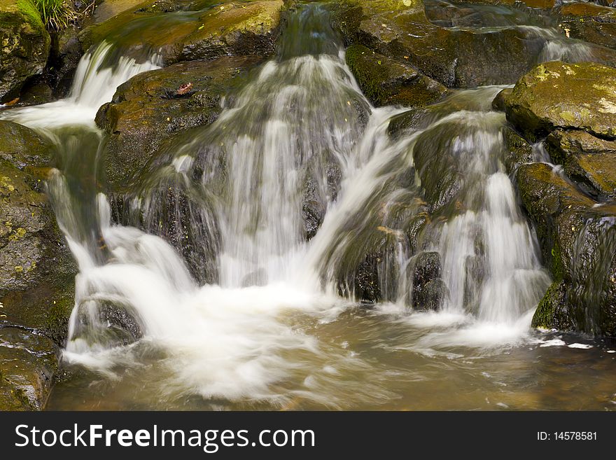 Rocky, stony river with a waterfall. Rocky, stony river with a waterfall.