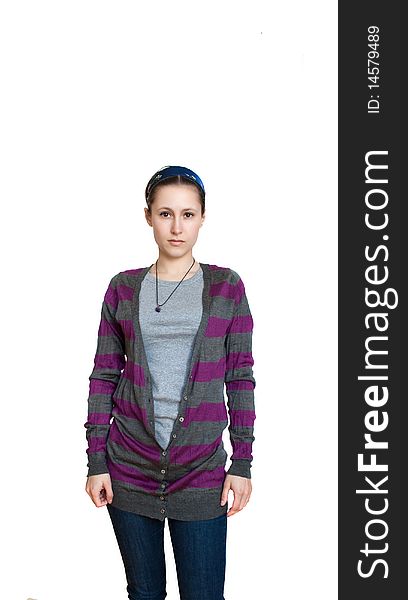 Young female in striped cardigan and jeans isolated. Young female in striped cardigan and jeans isolated