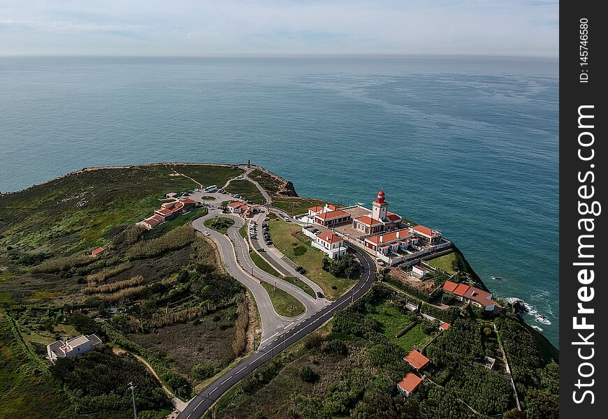 A view of a lighthouse Cabo da Roca, the most western tip of mainland Europe and Portugal. A view of a lighthouse Cabo da Roca, the most western tip of mainland Europe and Portugal.