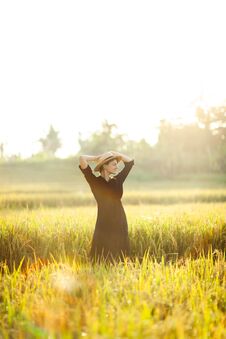 Woman In Black Dress And Straw Hat. Royalty Free Stock Image