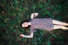 Top View Portrait Of A Beautiful Young Woman Or Girl Lying On Green Meadow Field Watching To The Sky And Enjoying Nature Summer Royalty Free Stock Photos