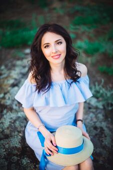 Close Up Portrait Of Young Woman In Blue Romantic Dress With Hat Sitting On The Stones. Calm And Harmony. Summer Vacation,fun, Royalty Free Stock Photos