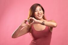 Young Asian Woman Show Heart Hand Sign Royalty Free Stock Images