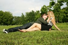 Young Man And Girl Kissing Outdoor Stock Photos