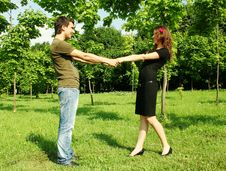 Young Man And Girl Holding For Hands Outdoor Stock Images