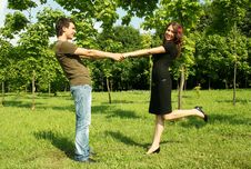 Young Man And Girl Holding For Hands Outdoor Stock Images