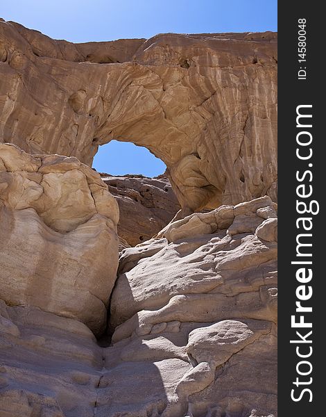 This arch located in Timna Park. The park is located approximately 25 kilometers north of Eilat, in the middle of the Red Sea Desert. This arch located in Timna Park. The park is located approximately 25 kilometers north of Eilat, in the middle of the Red Sea Desert.