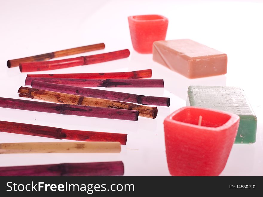 Spa concept with incense, soaps and candles isolated on white background