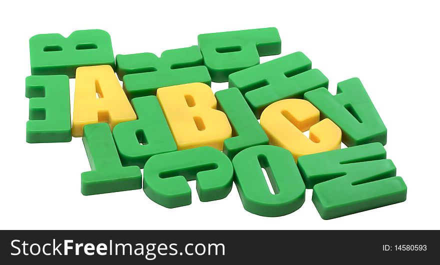Among the green letters are seen the first three letters of the alphabet. Among the green letters are seen the first three letters of the alphabet