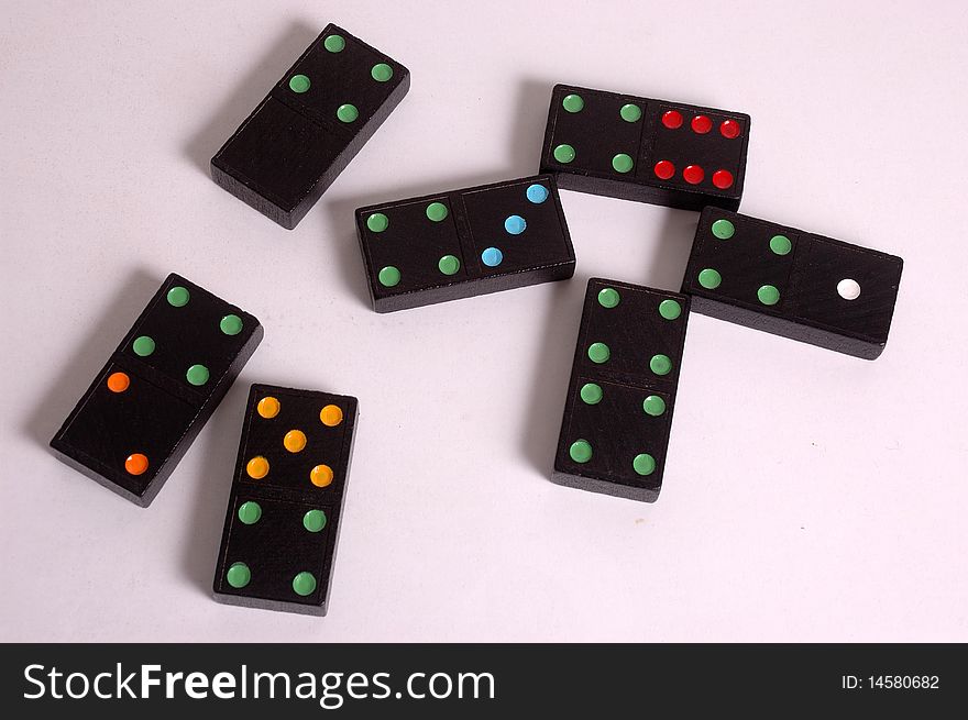 Colored domino tiles on white background