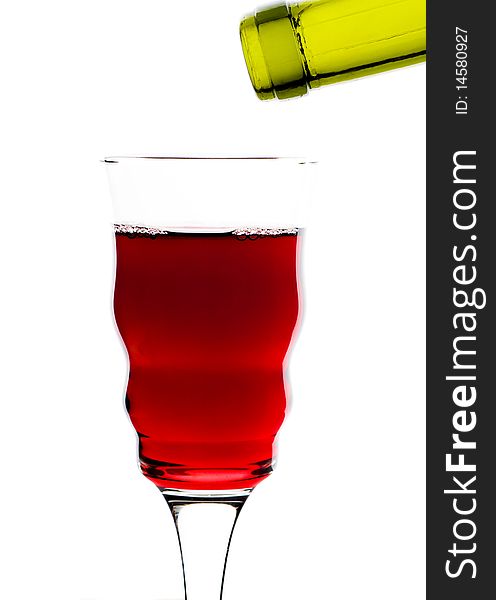 Red wine pouring into glass