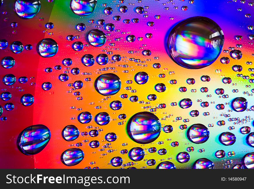 Water drops on colorful surface.