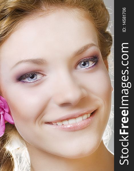 Portrait of young woman with with flowers in hair. Portrait of young woman with with flowers in hair